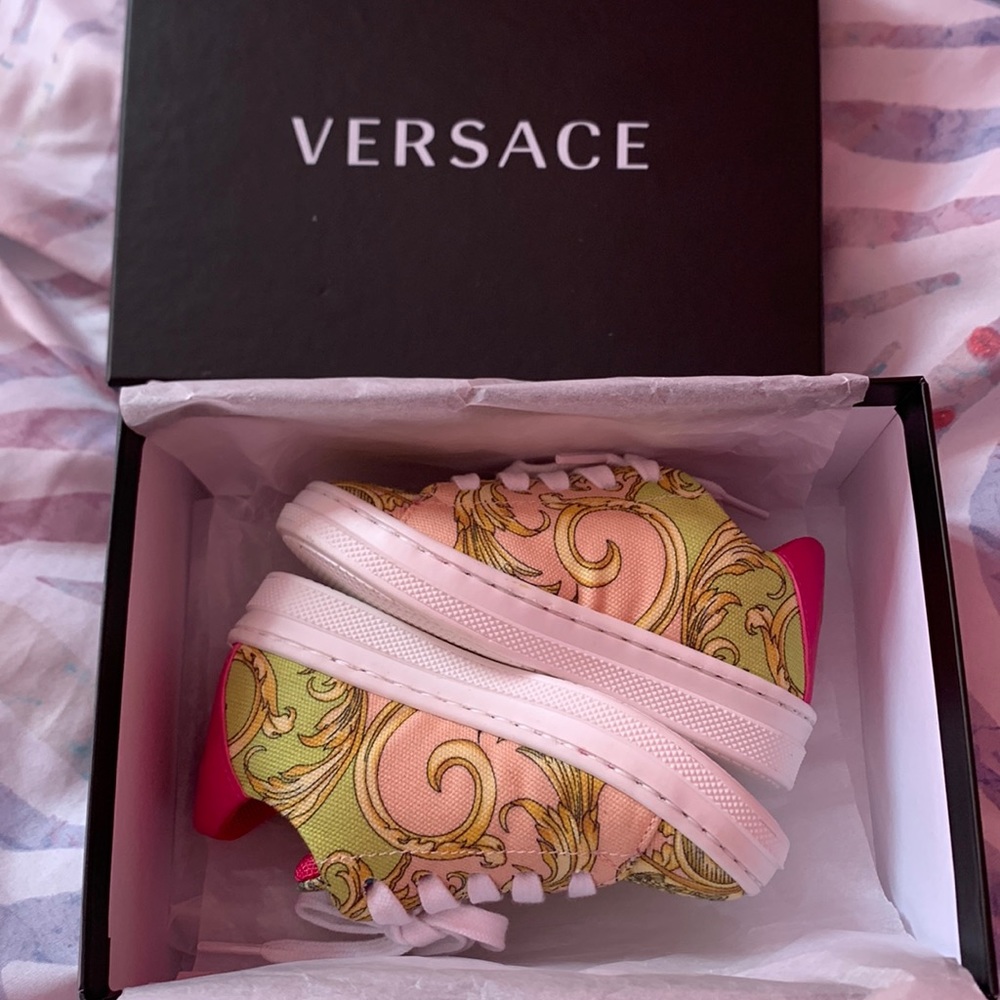I am selling a multi colored baby Versace brand sneaker.